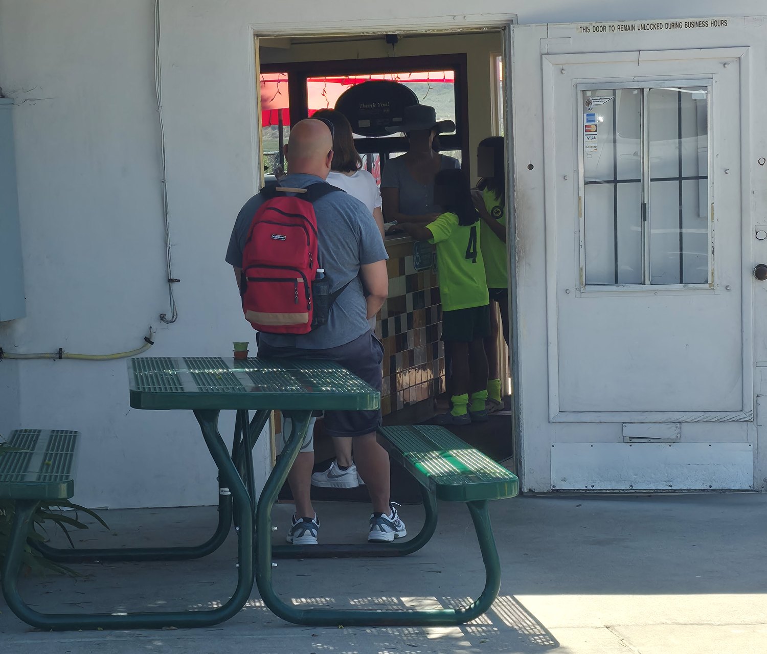 The table in use, blocking the path to the main entrance